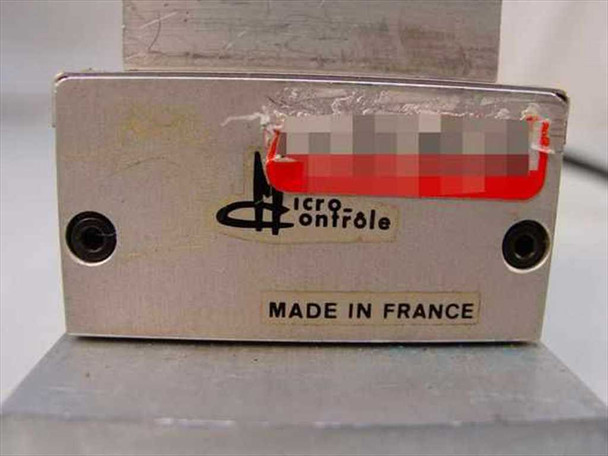 Micro Controle linear stage – label detail showing Micro Controle logo and Made in France plate; model number redacted