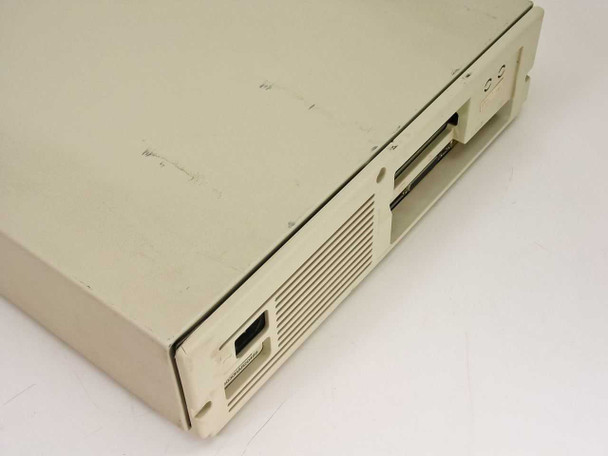 Compaq DeskPro 286n top-right view showing floppy drive bays, ventilation, and case wear with surface scratches
