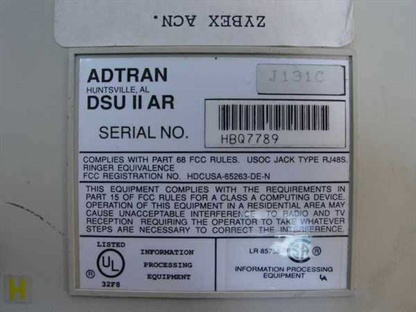 Adtran DSU II AR bottom label showing model DSU II AR, part number J131C, serial number HBQ7789, FCC Registration HDCUSA-65263-DE-N, UL Listed mark, manufactured in Huntsville AL