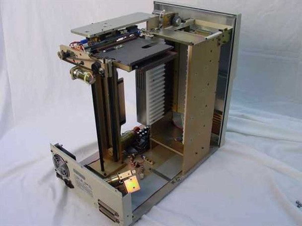 Plasmon 555700-000 internal view showing robotics mechanism, disc transport rails, lift assembly, and power supply with outer panels removed