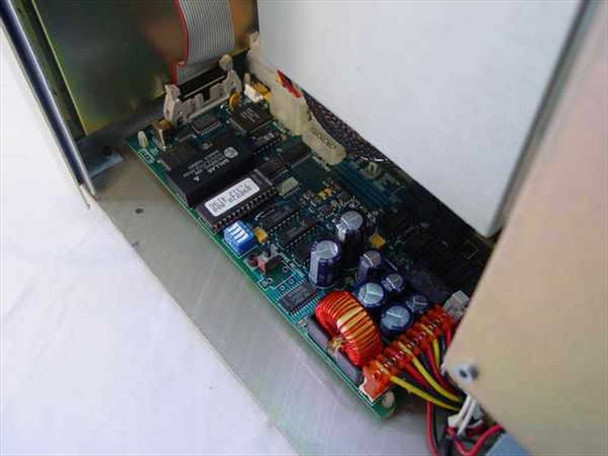 Plasmon 555700-000 internal control board close-up showing PCB with ICs, capacitors, inductors, and ribbon cable connector