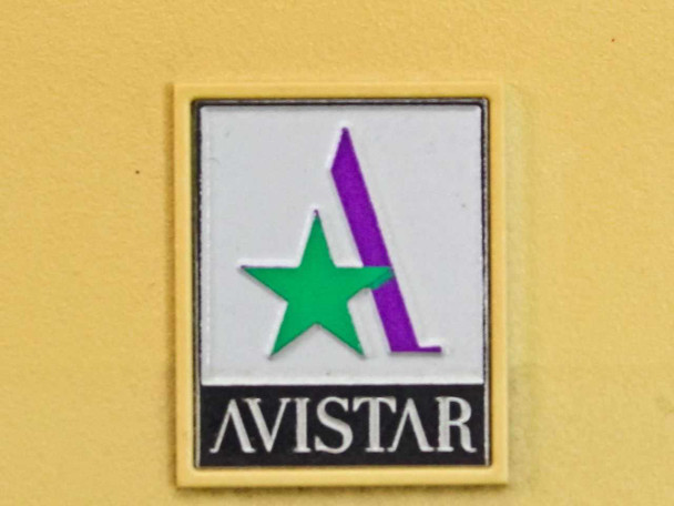 Close-up of Avistar logo badge on yellow housing of VideoLan 4e teleconference camera unit