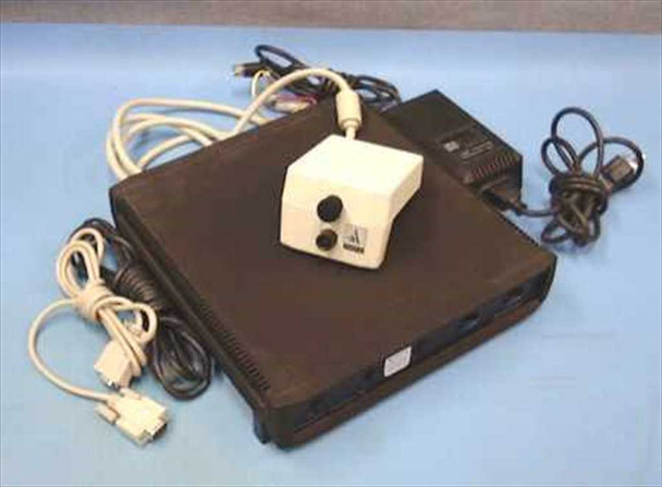 Avistar VideoLAN Interface 4e desktop videoconferencing unit with camera on top, power supply, and cables laid out — three-quarter front view