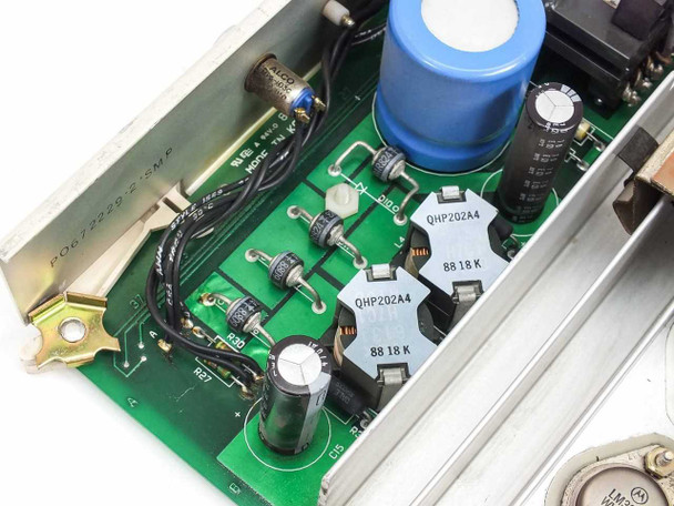 Nortel QPC691A PCB detail — close-up of power transistor section showing QHP202A4 transistors dated 8818K, small electrolytic and ceramic capacitors, and trim potentiometer