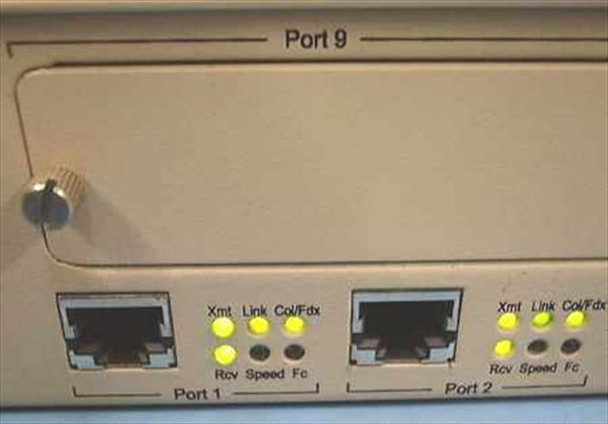 NBase NH 2012 front panel — Ports 1 and 2 RJ-45 with Xmt, Rcv, Link, Speed, Col/Fdx, Fc LED indicators lit; Port 9 expansion slot above