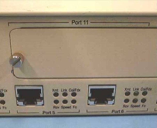 NBase NH 2012 front panel — Ports 5 and 6 RJ-45 with per-port LED indicators; Port 11 expansion slot above with captive screw