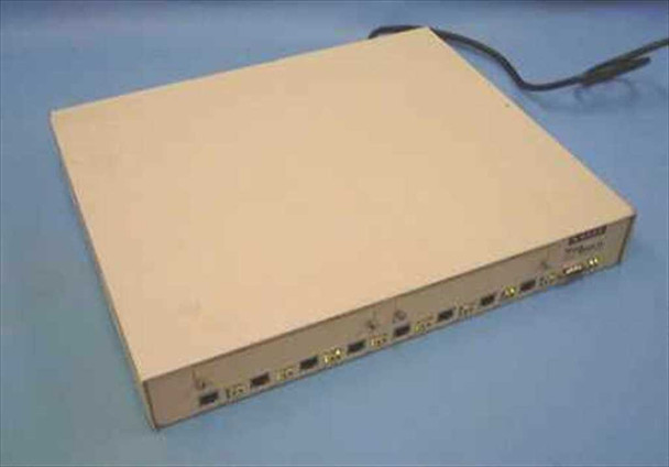 NBase Communications NH 2012 Mega Switch II — three-quarter front view showing beige desktop chassis with front-panel RJ-45 ports and power cable