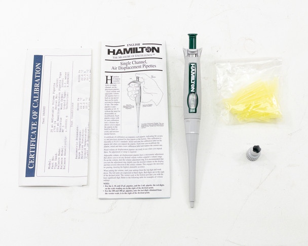 Hamilton 55019-34 SoftGrip pipette laid out with calibration certificate, instruction manual, calibration tool, and bag of yellow Fisherbrand pipette tips