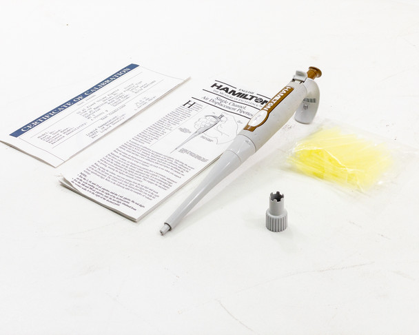 Hamilton 55019-07 pipette kit components — pipette body with gold SoftGrip accents, calibration certificate, instruction manual, calibration adjustment tool, and pipette tips bag