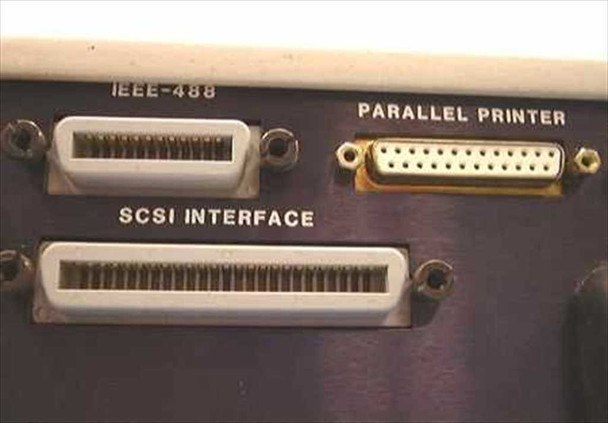 Tekelec TE713 rear panel close-up showing IEEE-488, Parallel Printer, and SCSI Interface connectors