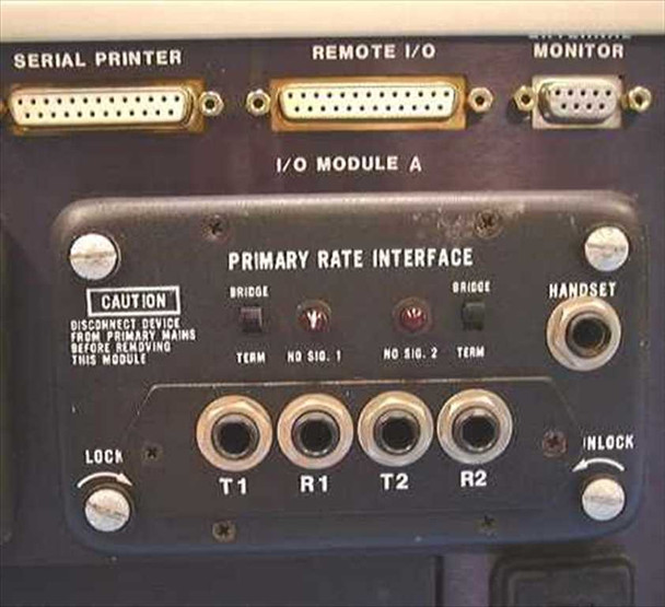 Tekelec TE713 I/O Module A showing Primary Rate Interface with T1 R1 T2 R2 ports, Serial Printer, Remote I/O, and External Monitor connectors