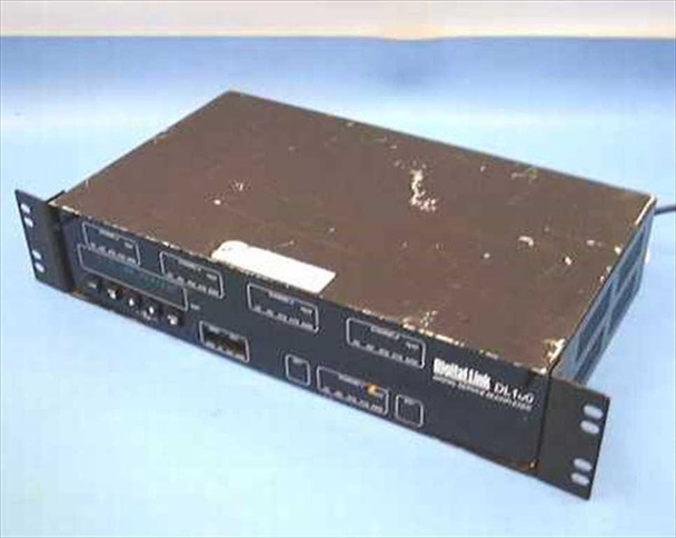 Digital Link DL100 T1 Digital Service Multiplexer — angled front and top view showing rackmount chassis with heavy cosmetic wear and scratches