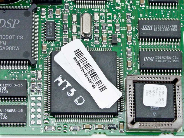 US Robotics Sportster 28800 — close-up of main DSP controller chip with inventory barcode sticker and ISSI SRAM chips visible