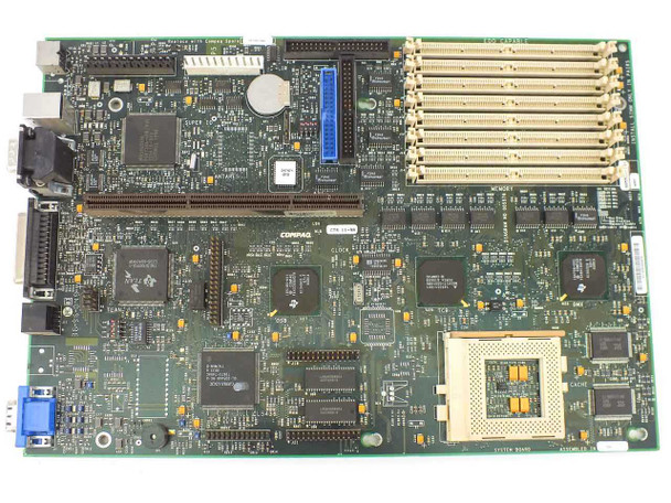 Compaq 247382-001 system board top-down view showing Compaq label, Cirrus Logic video chip, SIMM banks, floppy and IDE headers, and rear port cluster