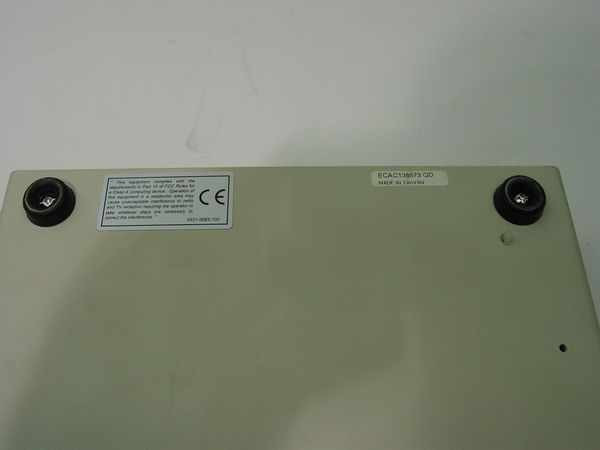 Belkin F1T015 AutoSwitch Plus bottom label showing CE mark, regulatory compliance text, and 'Made in Canada' label