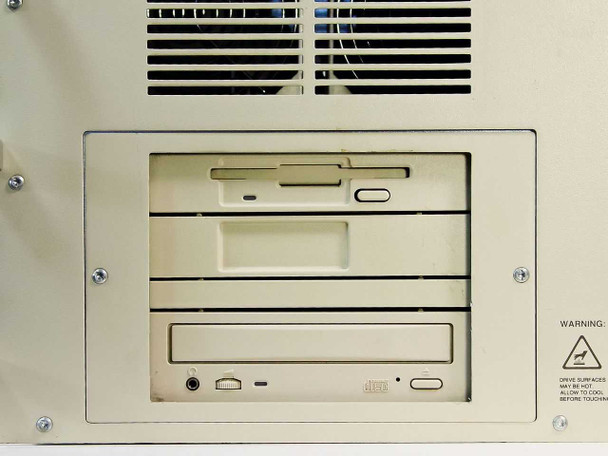 Front drive bay panel showing 3.5-inch floppy drive and 4X CD-ROM drive installed