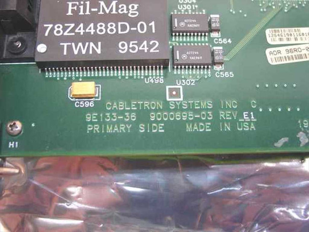 Cabletron 9E133-36 PCB silkscreen showing model 9E133-36, assembly 9000695-03 Rev E1, Made in USA, and Fil-Mag 78Z4488D-01 magnetics