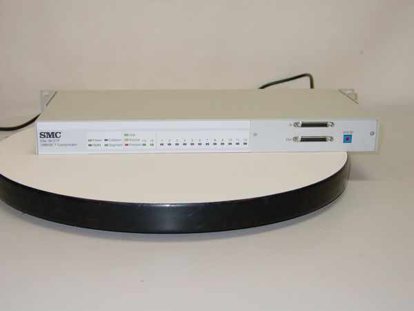 SMC Elite 3812TP 10BASE-T concentrator – front panel view showing SMC logo, status LEDs, and two AUI/stacking ports on right