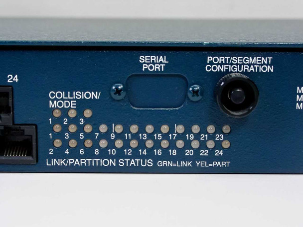 Ungermann-Bass STM24 front panel right section — Serial Port (DB-9), Port/Segment Configuration rotary switch, per-port Link/Partition status LED array