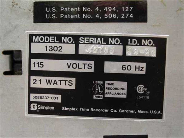 Simplex 1302 time clock – rear rating plate showing Model 1302, 115V, 60Hz, 21 Watts, part number 5086237-001, UL listing, and U.S. Patent numbers