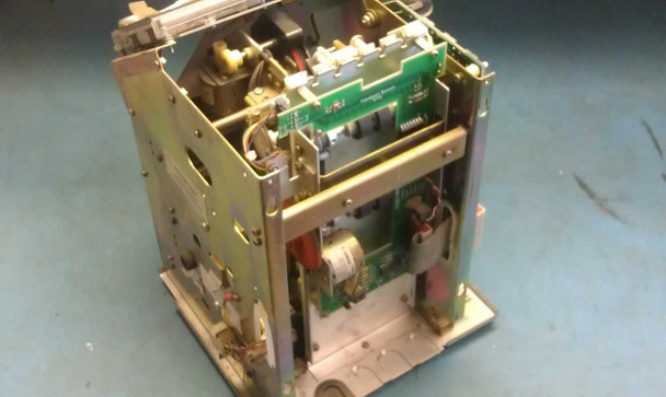Simplex 1302 time clock – internal view with housing removed showing mechanical and electronic components, circuit boards, and card-punch mechanism