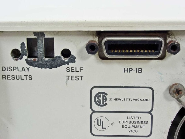 HP 9144A rear panel close-up – DISPLAY RESULTS and SELF TEST buttons (with damage around mounting holes), HP-IB connector, CSA and UL EDP/Business Equipment listings