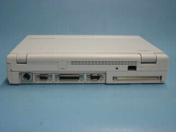 Toshiba T4400SXC rear port panel showing PS/2, serial DB9, parallel DB25, serial DB9, and floppy drive bay