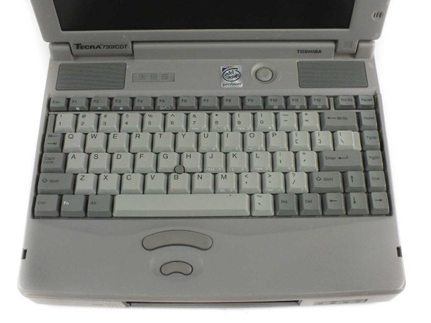 Toshiba Tecra 730XCDT keyboard close-up showing Intel Pentium MMX sticker and model label on lid