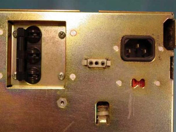 Astec AA13010 power supply – rear input panel showing IEC C14 AC inlet, voltage selector header, and red fuse/varistor component