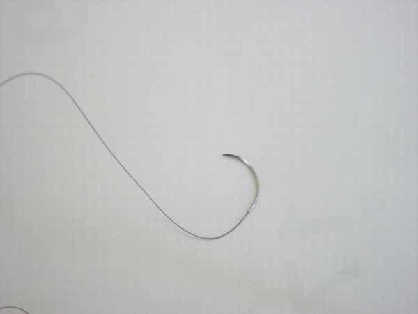Close-up of Ethicon 662 Ethilon 4-0 nylon suture curved FS-2 cutting needle tip