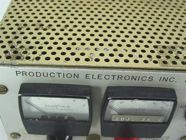 Production Electronics LS-40/5 – close-up of front panel showing Amperes and Volts analog meters with ADJ. 24V marking and brand label