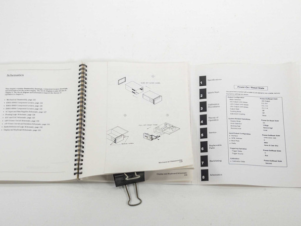 Agilent E3631A Service Guide open to schematics section, showing wiring diagrams and tabbed divider pages