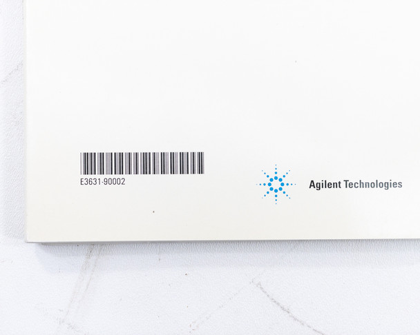 HP Agilent E3631A User's Guide – inside back cover with barcode and part number E3631-90002, Agilent Technologies logo
