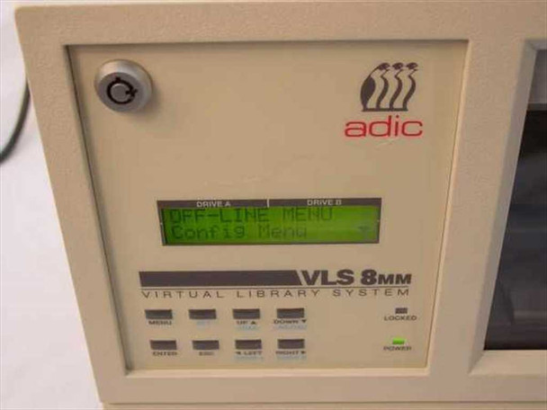 ADIC VLS-8MM front panel close-up showing LCD display with Drive A and Drive B menus, navigation buttons, and VLS 8MM Virtual Library System label