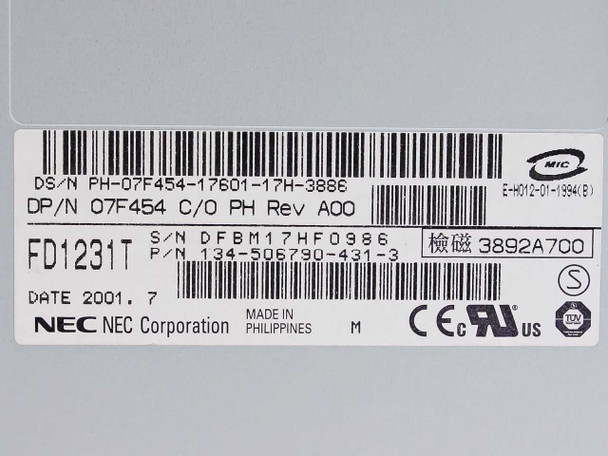 Dell 07F454 NEC FD1231T floppy drive — close-up of label showing model FD1231T, Dell DP/N 07F454, part number 134-506790-431-3, NEC Corporation, Made in Philippines, Date 2001.7