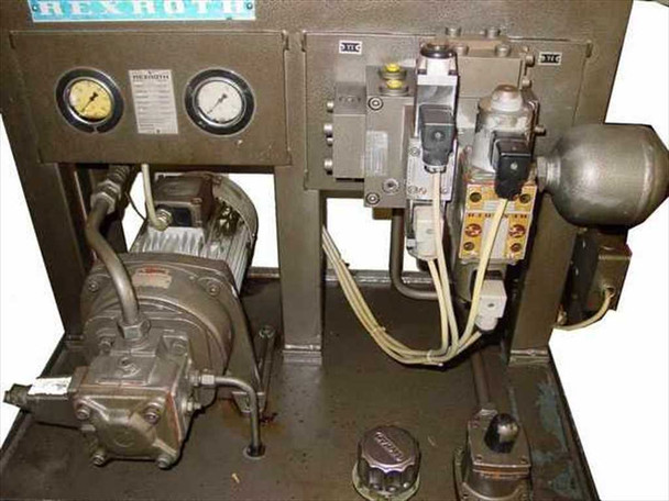Rexroth Fibro UFMS hydraulic unit — left-side view showing Rexroth-branded dual pressure gauges, pump/motor assembly, and solenoid valve block