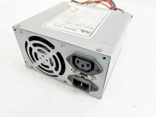 Sheng-Ker SKS-230W AT switching power supply rear panel showing IEC C14 input and C13 outlet connectors with cooling fan