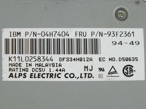 Alps DF334H012A label closeup showing IBM P/N 04H7404, FRU P/N 93F2361, date code 94-49, DC 5V 1.44A rating, Made in Malaysia, Alps Electric Co. Ltd.