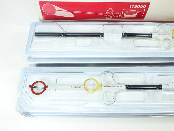 Two sealed tray packs of USSC Endo Catch 173050 specimen pouches removed from box, showing contents through clear plastic