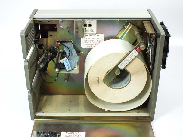 Intermec 8636AT interior view with cover open – label roll stock loaded, internal mechanism visible, printhead absent