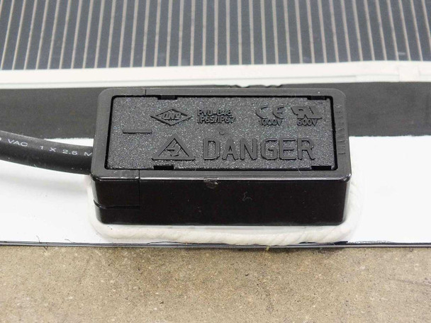 SoloPower SP1-75 junction box showing IP65/IP67 rating, 1000V/600V markings, and DANGER warning label