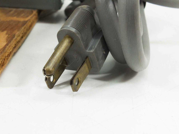 Circle A-W Meter Socket power cord 2-prong plug close-up showing brass blades with oxidation and wear