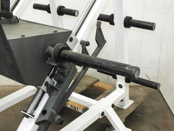 Hoist F-355 leg press carriage bar and multiple lockout position slots – wide view showing white frame uprights with adjustment notches and bar hardware
