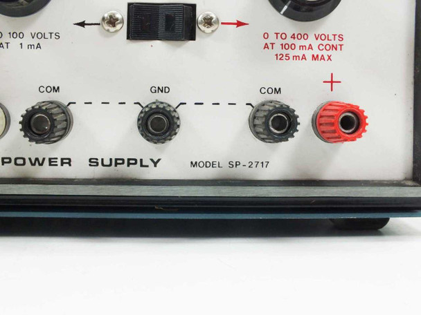Heath SP-2717 front panel lower section close-up showing MODEL SP-2717 label, COM/GND/COM binding posts, red positive post, and output spec label 0-400V at 100mA cont 125mA max