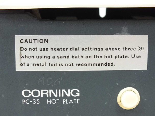 Corning PC-35 Hot Plate – close-up of front panel caution label and Corning logo with handwritten mark