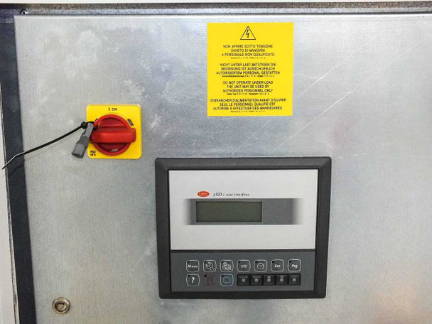 Motivair MPC-FC-0500 — Carel pCO controller display panel with red rotary on/off switch and multilingual electrical warning label