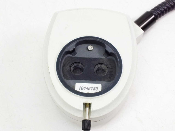 Leica 10446180 coaxial ring illuminator – bottom view showing dual circular output ports, part number label 10446180, and brass adjustment screw