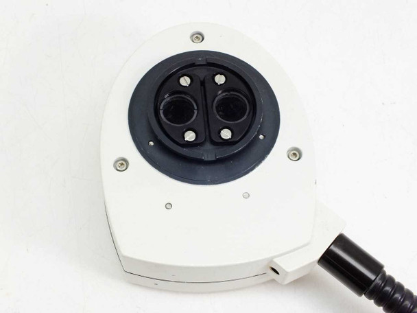 Leica 10446180 coaxial light source – top-down view of ring illuminator face showing dual output apertures, retaining screws, and fiber optic cable exit