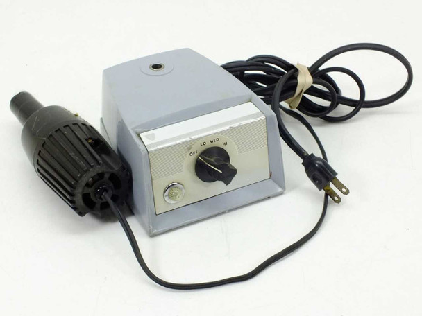 American Optical 365 Microscope Illuminator – front-left view showing gray housing, rotary intensity dial, power cord, and black lamp head probe