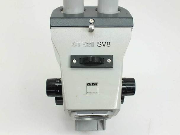 Zeiss Stemi SV8 microscope head — front panel close-up showing STEMI SV8 nameplate, Zeiss West Germany logo, zoom thumbwheel, and magnification scale